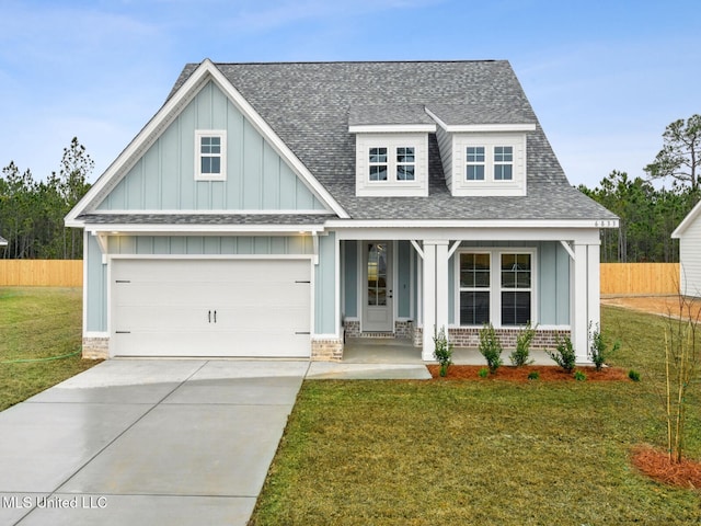 10501 Glade Cv, Gulfport, MS 39503 - craftsman-style house featuring a shingled roof, a porch, board and batten siding, driveway, and brick siding