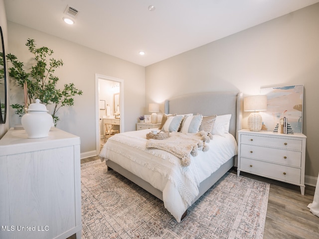 10501 Glade Cv, Gulfport, MS 39503 - bedroom with wood finished floors and ensuite bath