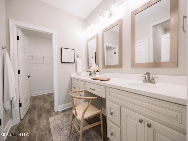 10501 Glade Cv, Gulfport, MS 39503 - full bath with double vanity, wood finished floors, and a spacious closet