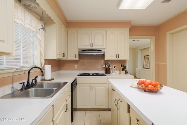 kitchen with white gas stovetop, dishwasher, sink, light tile patterned floors, and crown molding