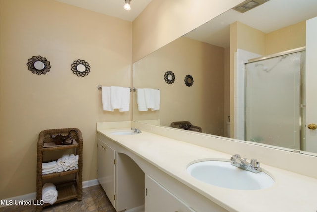 bathroom with vanity and an enclosed shower