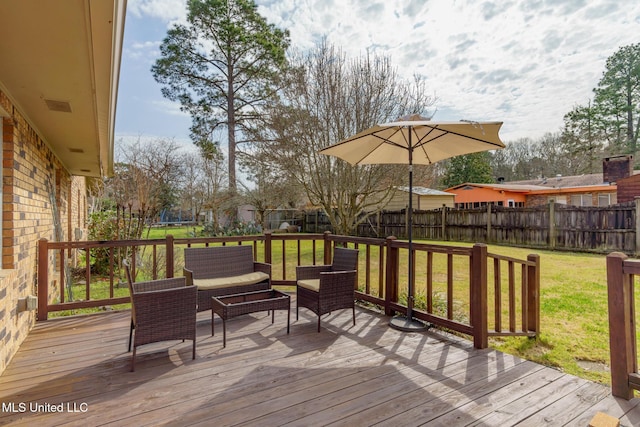 deck featuring a yard, an outdoor hangout area, and a trampoline