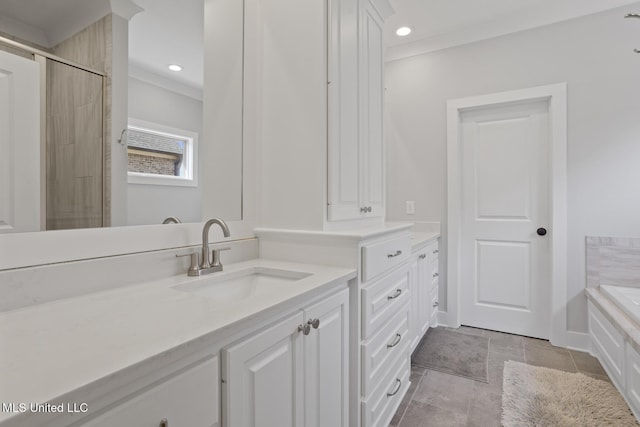 full bathroom with crown molding, a bathtub, vanity, and recessed lighting