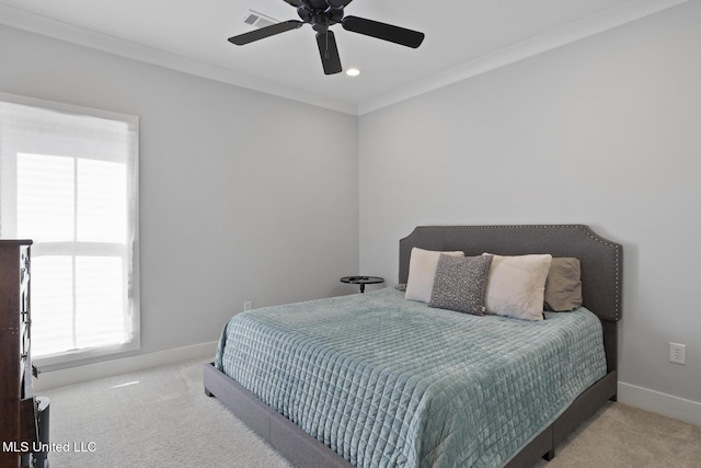 bedroom with light carpet, baseboards, visible vents, and ornamental molding