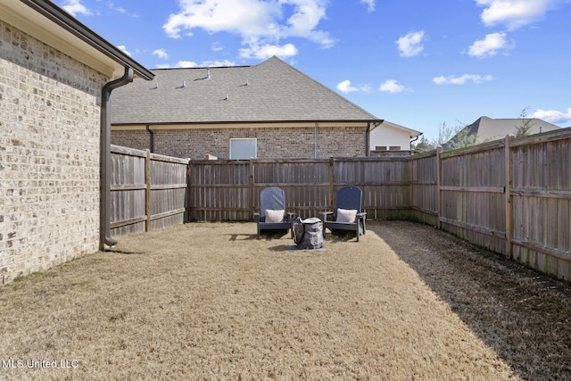 view of yard with a fenced backyard