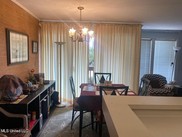 dining area with a chandelier and ornamental molding