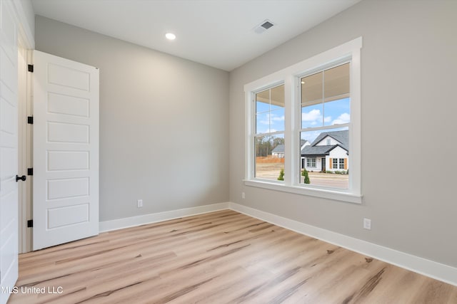 unfurnished room featuring light wood-type flooring