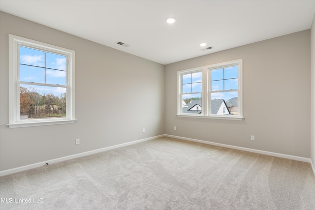 unfurnished room featuring carpet