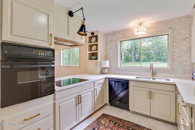 4638 Katherine Blvd, Jackson, MS 39211 - kitchen featuring black appliances, a sink, healthy amount of natural light, and light tile patterned floors