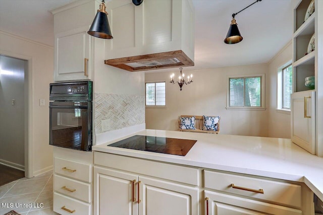 4638 Katherine Blvd, Jackson, MS 39211 - kitchen with black appliances, ventilation hood, light countertops, and light tile patterned floors