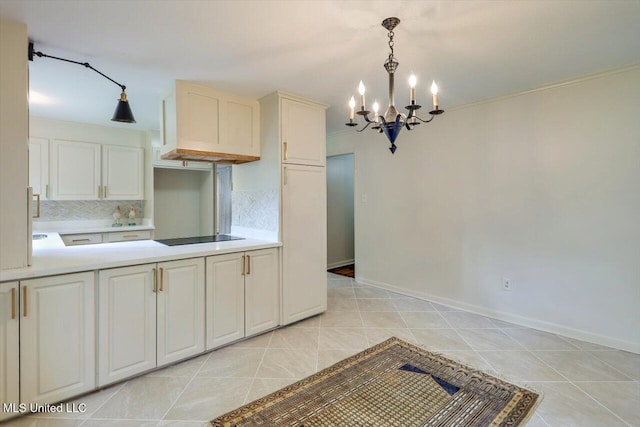 4638 Katherine Blvd, Jackson, MS 39211 - kitchen featuring a chandelier, light countertops, decorative backsplash, and pendant lighting