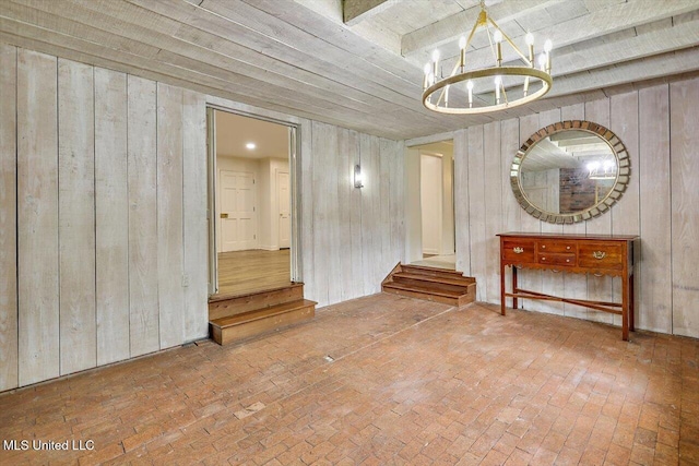 4638 Katherine Blvd, Jackson, MS 39211 - unfurnished room featuring a chandelier, brick flooring, wooden walls, and wood ceiling
