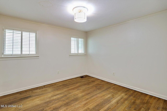 4638 Katherine Blvd, Jackson, MS 39211 - unfurnished room with crown molding, wood finished floors, and baseboards