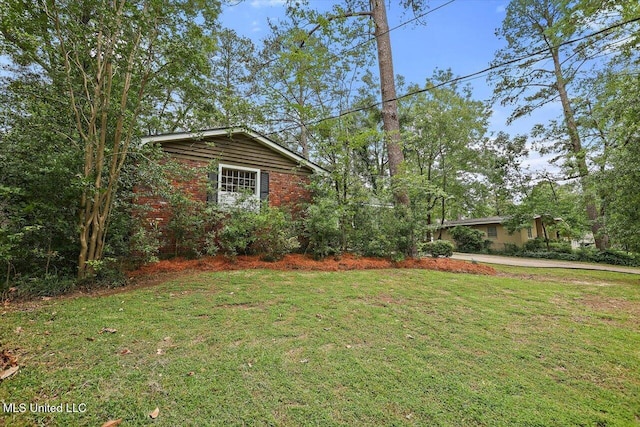 4638 Katherine Blvd, Jackson, MS 39211 - view of grassy yard featuring driveway
