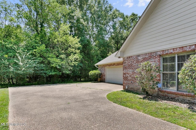 view of side of home with a garage