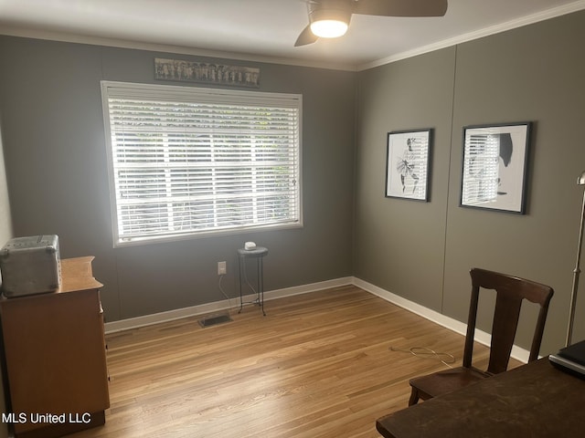 interior space featuring ceiling fan, ornamental molding, and light hardwood / wood-style floors