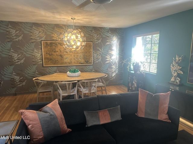 dining room featuring hardwood / wood-style flooring and a chandelier