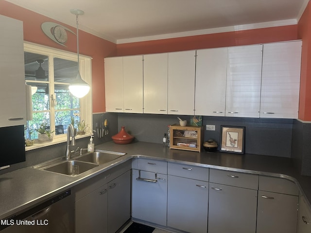 kitchen with decorative light fixtures, sink, white cabinets, stainless steel dishwasher, and crown molding