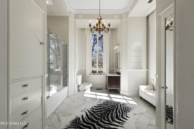 full bathroom featuring a chandelier, toilet, a shower with shower door, vanity, and marble finish floor