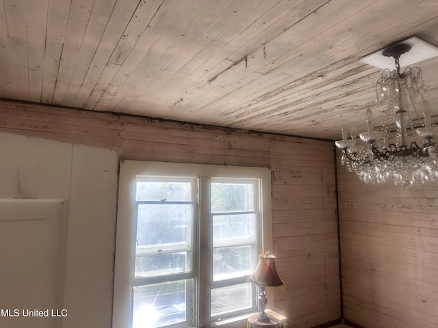 1003 41st Ave, Gulfport, MS 39501 - unfurnished room featuring wood ceiling, a chandelier, and wood walls