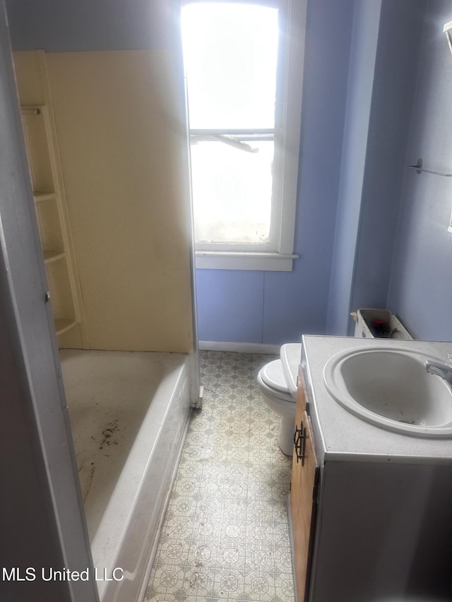 1003 41st Ave, Gulfport, MS 39501 - full bathroom featuring toilet, vanity, a tub to relax in, and a shower