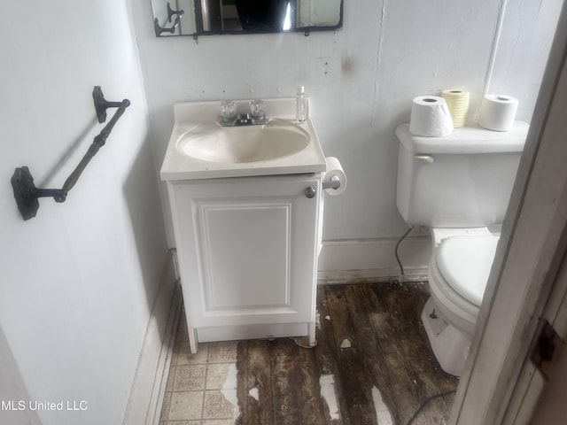 1003 41st Ave, Gulfport, MS 39501 - bathroom featuring toilet, vanity, and baseboards