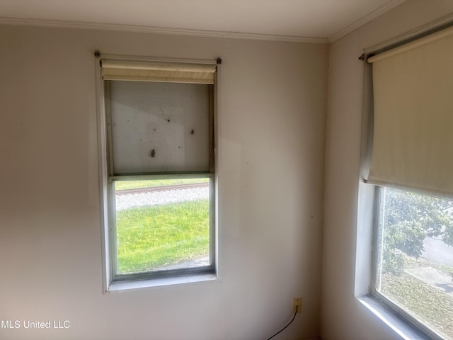 1003 41st Ave, Gulfport, MS 39501 - unfurnished room featuring healthy amount of natural light and crown molding
