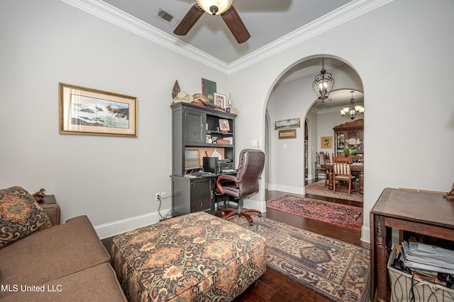 home office with baseboards, ornamental molding, ceiling fan with notable chandelier, wood finished floors, and arched walkways