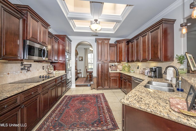 kitchen with light tile patterned flooring, arched walkways, a sink, stainless steel appliances, and crown molding