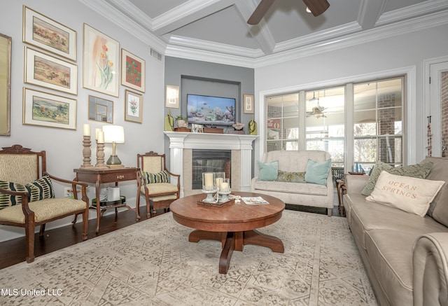 interior space with wood finished floors, visible vents, coffered ceiling, and ceiling fan