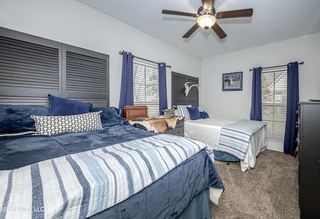 carpeted bedroom featuring a ceiling fan