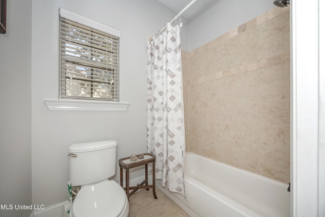 full bath with tile patterned flooring, shower / tub combo, and toilet