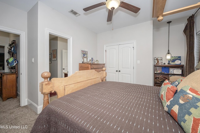 bedroom with visible vents, a ceiling fan, a closet, carpet, and baseboards