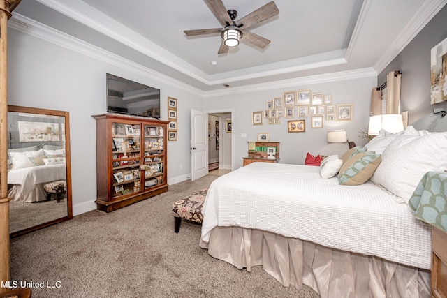 bedroom featuring ceiling fan, baseboards, ornamental molding, carpet floors, and a raised ceiling