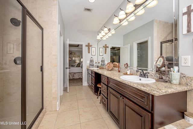 bathroom with tile patterned floors, visible vents, a stall shower, and ensuite bath