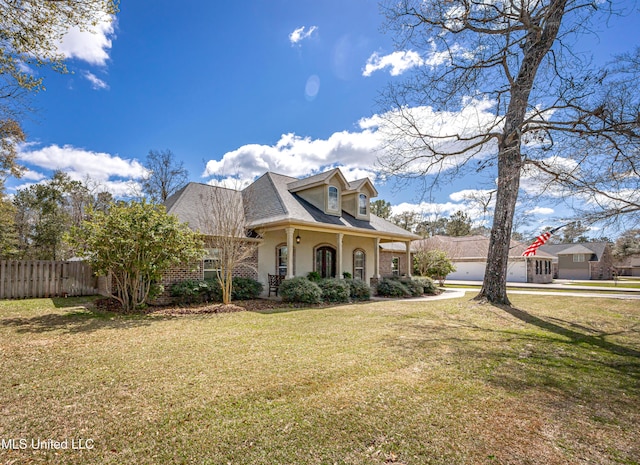 view of property exterior with brick siding, stucco siding, a lawn, and fence