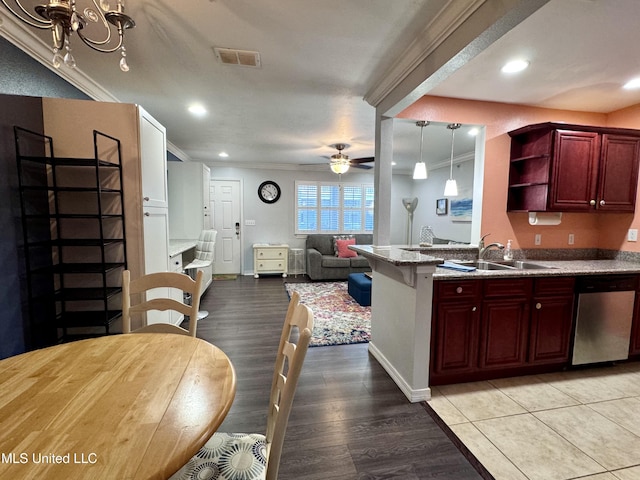 kitchen featuring dishwasher, sink, ceiling fan, ornamental molding, and light hardwood / wood-style floors