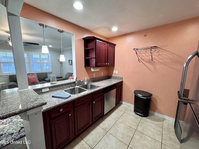 kitchen featuring ceiling fan, sink, stainless steel dishwasher, pendant lighting, and light tile patterned floors