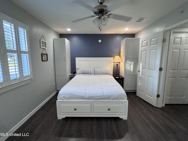 bedroom featuring dark hardwood / wood-style flooring and ceiling fan