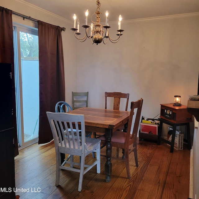 dining space with a chandelier, wood-type flooring, and ornamental molding