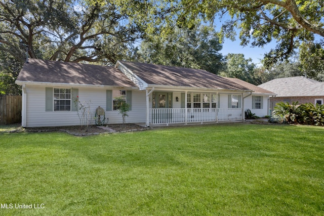 ranch-style home with covered porch and a front lawn