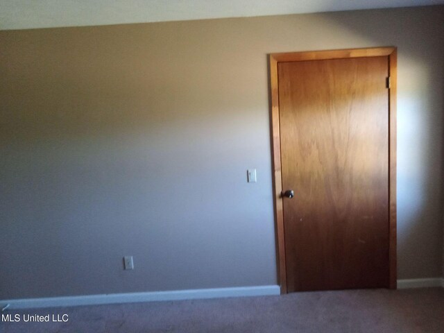 120 Harrison Ln, Yazoo City, MS 39194 - unfurnished bedroom with carpet flooring and baseboards