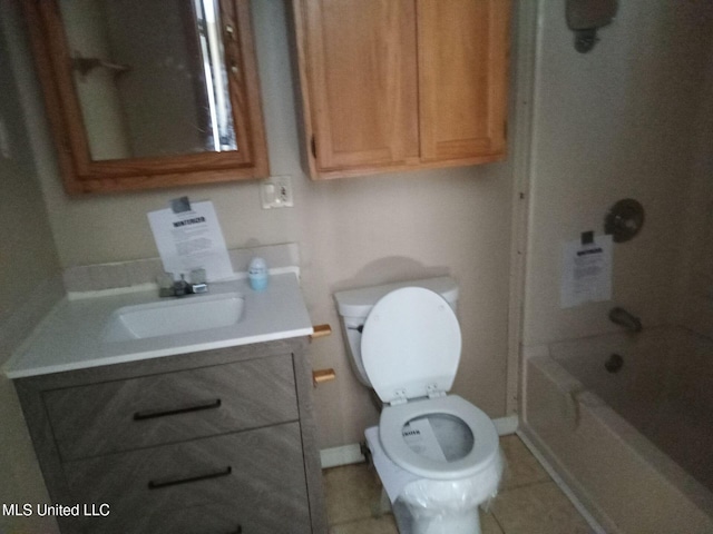 120 Harrison Ln, Yazoo City, MS 39194 - bathroom featuring vanity, toilet, washtub / shower combination, tile patterned flooring, and baseboards