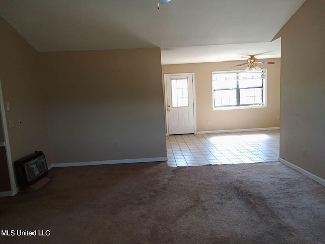 120 Harrison Ln, Yazoo City, MS 39194 - unfurnished living room featuring ceiling fan, carpet floors, tile patterned floors, and baseboards