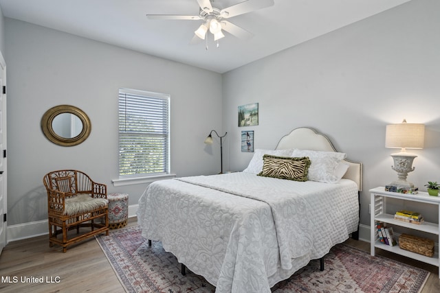 bedroom with ceiling fan and wood-type flooring