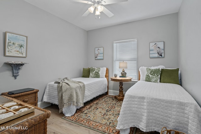 bedroom featuring light wood-type flooring and ceiling fan