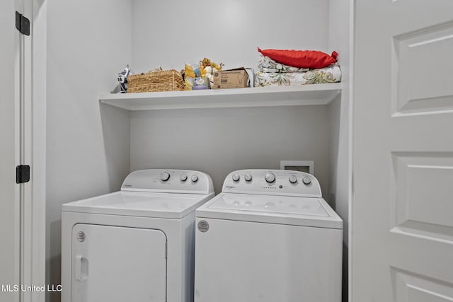 washroom with washer and dryer