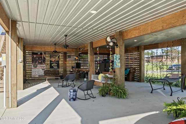 view of patio featuring ceiling fan