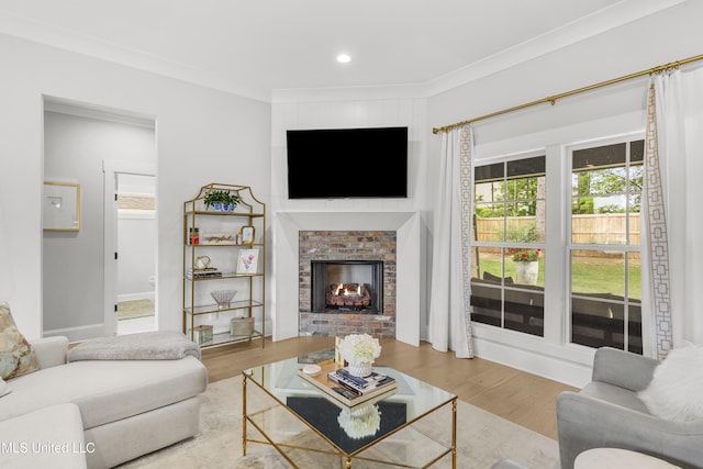 118 Seymour Dr, Madison, MS 39110 - living room featuring wood finished floors, crown molding, a brick fireplace, and recessed lighting