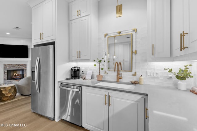118 Seymour Dr, Madison, MS 39110 - kitchen with appliances with stainless steel finishes, a sink, light countertops, white cabinets, and recessed lighting